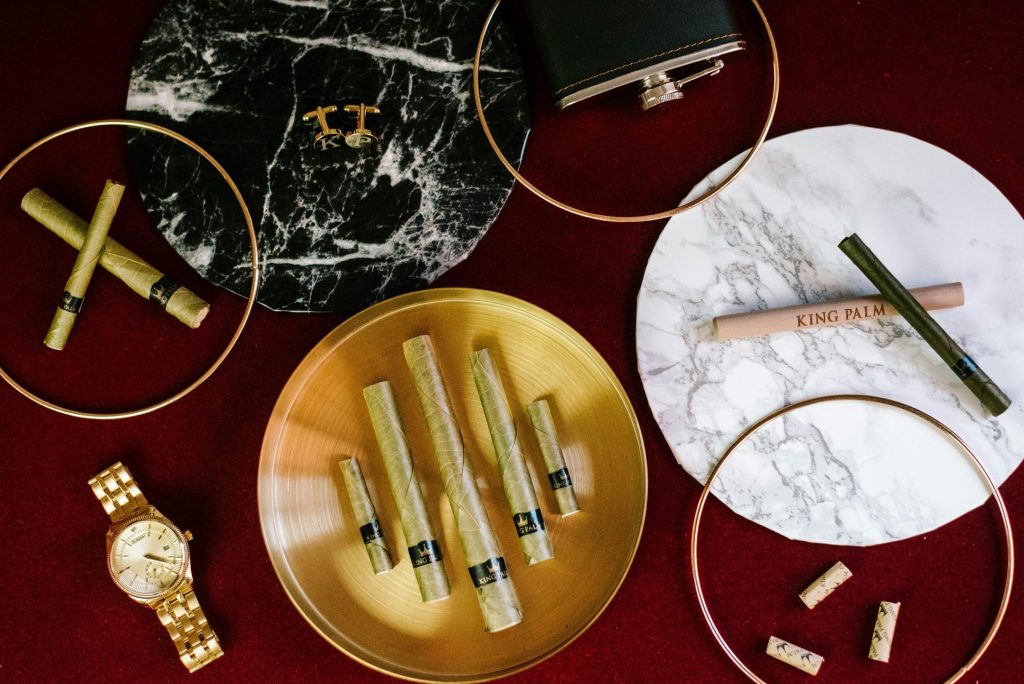 round gold-colored analog watch